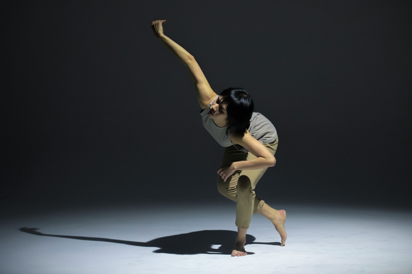 a woman standing on one leg in a pose